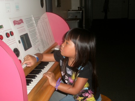 Kasen playing the organ at Science Center